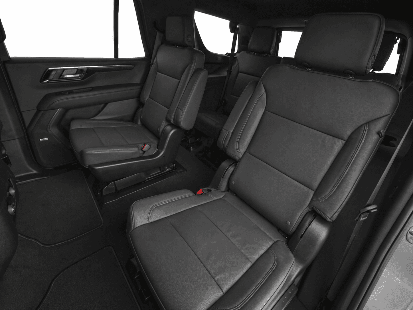 Chauffeur assisting guests at an airport transfer pickup
